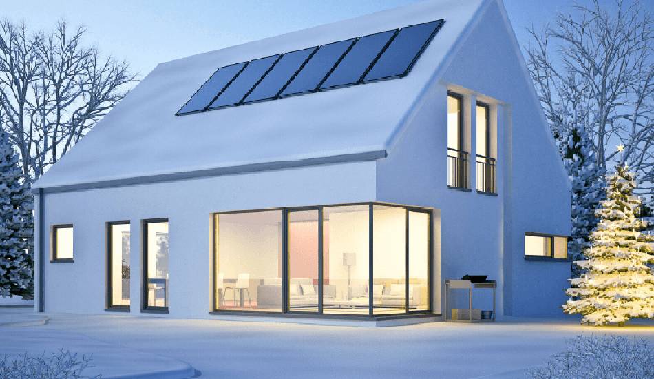 House with modern solar panels installed on the roof